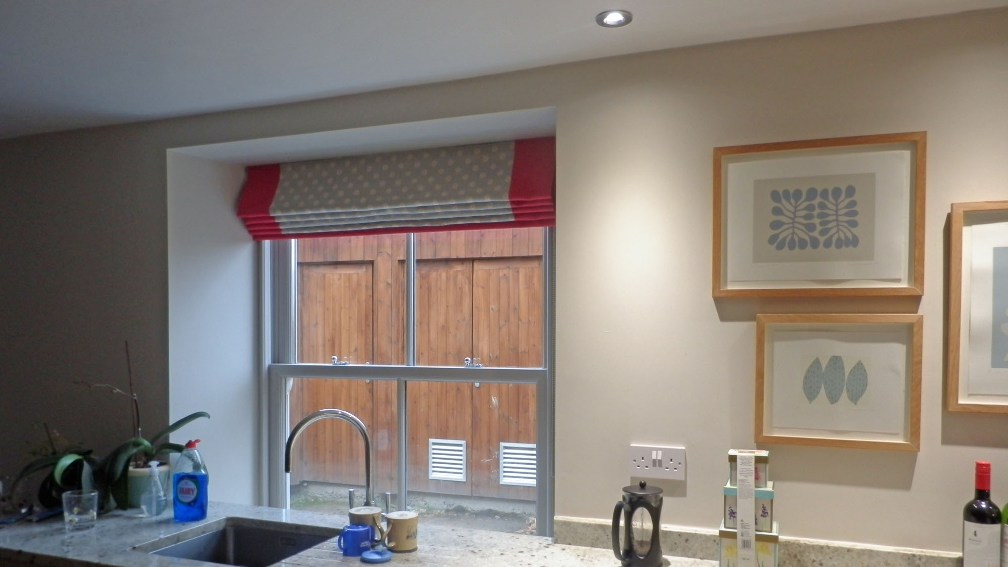 Roman blind with a coloured border on each side and on the bottom edge