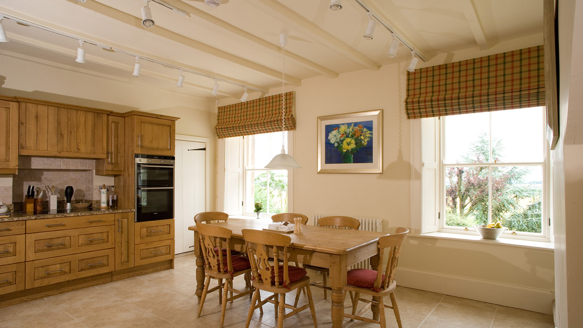Large roman blinds in a farmhouse kitchen